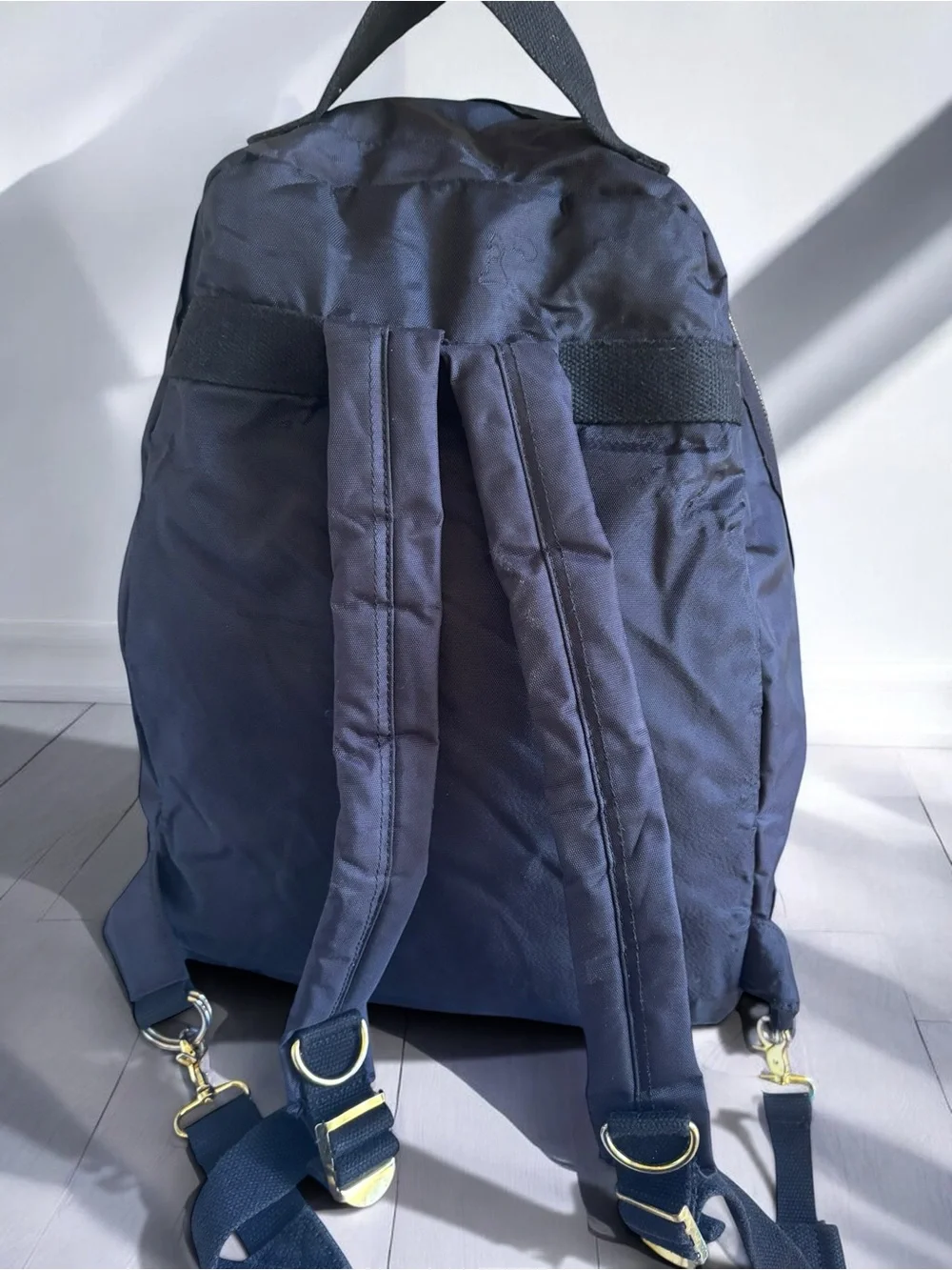 Jean Studded Backpack designed with an edgy  streetwear aesthetic.